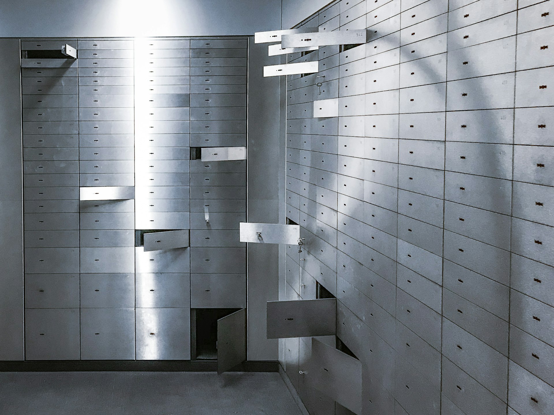 Wall of numbered safe deposit boxes